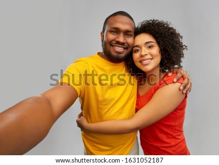 Similar – Image, Stock Photo Black woman taking selfie photograph with happy expression