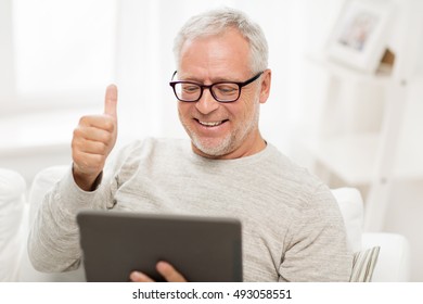 technology, people and lifestyle, distance learning concept - happy senior man with tablet pc computer having video call at home - Shutterstock ID 493058551