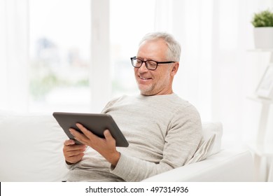 Technology, People And Lifestyle, Distance Learning Concept - Senior Man With Tablet Pc Computer At Home