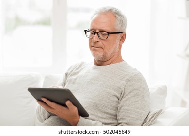 Technology, People And Lifestyle, Distance Learning Concept - Senior Man With Tablet Pc Computer At Home