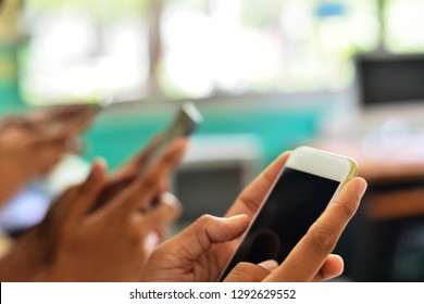 Technology and phone addiction concept.Young Influencer millennial Using Social Media on Smartphone, Like, Follower, Comment and share on internet social media. self absorbed new generation of younger
