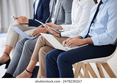 Technology, recruitment and business people waiting in queue for job interview process in office. Human resources, meeting and group of hiring candidates with phone, laptop and tablet for vacancy.