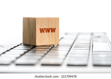 Technology Still Life Of WWW Wooden Block On Computer Keyboard.