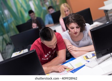 technology students group in computer lab school  classroom working on