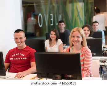 technology students group in computer lab school  classroom working on