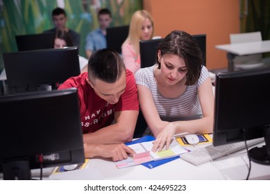 technology students group in computer lab school  classroom working on