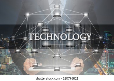 Technology Text and Distributed computer network with Businessman holding the tablet over the Modern business building glass of skyscrapers, Distributed ledger technology and block chain concept