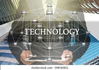 Technology Text and Distributed computer network with Businessman holding the tablet over the Modern business building glass of skyscrapers, Distributed ledger technology and block chain concept