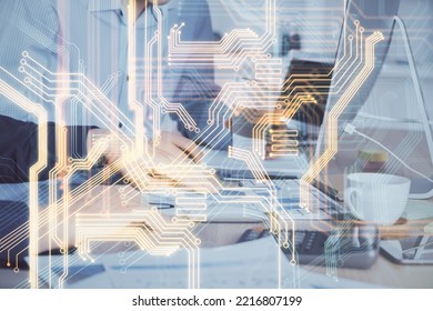 Technology Theme Hologram With Man Working On Computer On Background. High Tech Concept. Multi Exposure.