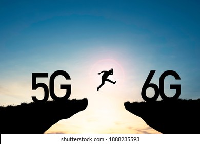 Technology transformation change  from 5G to 6G , Silhouette businessman jumping from 5G cliff to 6G cliff on blue sky.