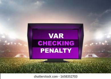 technology var checking penalty.The video assistant referee scene a match official in football stadium.  - Shutterstock ID 1658352703
