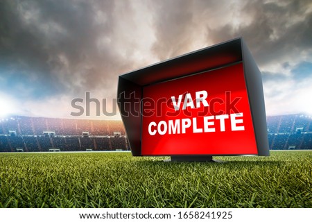 technology var decision complete.The video assistant referee scene a match official in football stadium. 