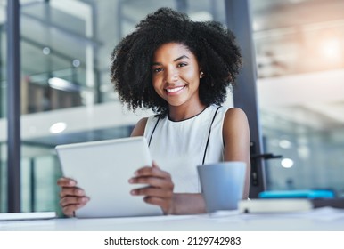 Technology will help you be more efficient. Cropped shot of an attractive young businesswoman working in her office. - Shutterstock ID 2129742983