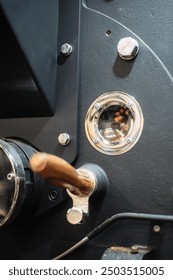 technology window of coffee roastery machine during working operations with green beans