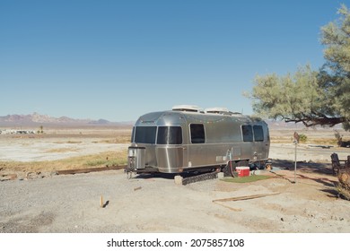 Tecopa, California, USA - November 12, 2020: image of an Airstream camper shown parked in the desert.