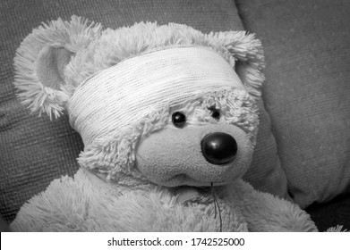 Teddy Bear With A Bandage On His Head. The Concept Of Trauma In A Child, Black And White.