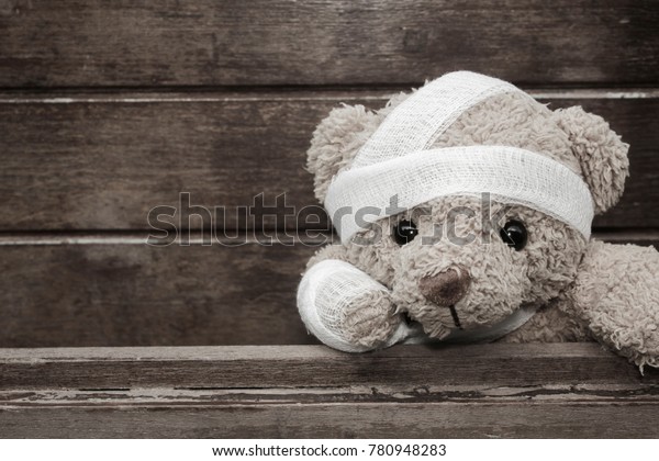 teddy bear with broken arm