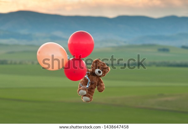 Teddy bear flying with balloons baby girl's bedroom wallpaper