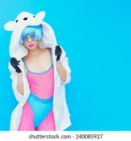 Teddy Bear Girl On  Blue Background. Crazy Winter Party. Club Dance Style