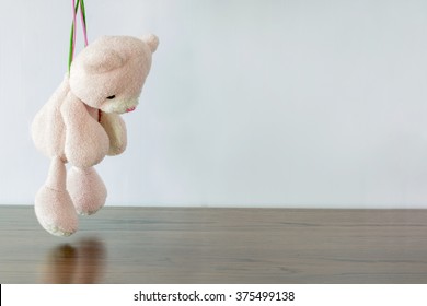 teddy bear hanging on gibbet