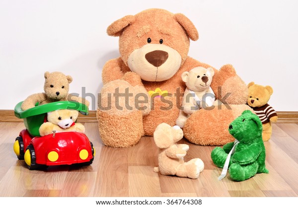 Teddy bear having fun. Many bear toys\
playing, one big happy family of bear toys\
playing