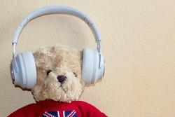 Teddy Bear And Headphones Are Modern Technology.