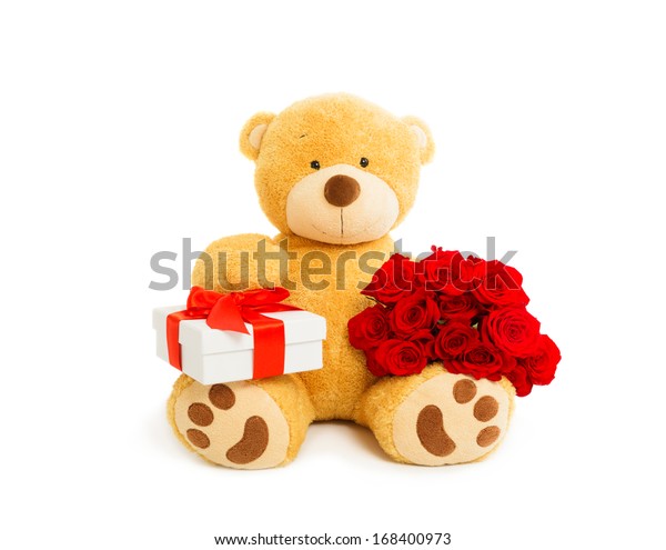 teddy bear holding gift box