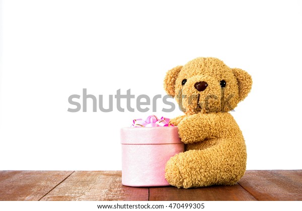 teddy bear holding a box