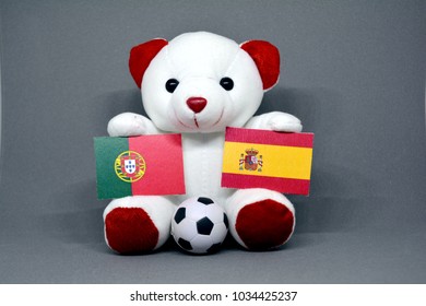 Teddy Bear Holding Portugal And Spain Flag With A Football