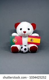 Teddy Bear Holding Portugal And Spain Flag With A Football