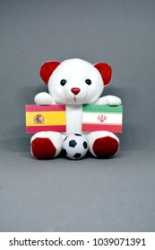 Teddy Bear Holding Spain And Iran Flag With A Football