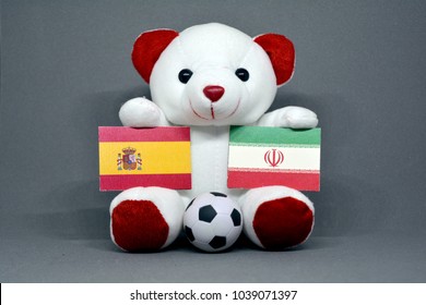 Teddy Bear Holding Spain And Iran Flag With A Football