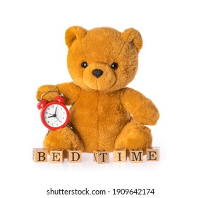teddy bear holds clock isolated on white background