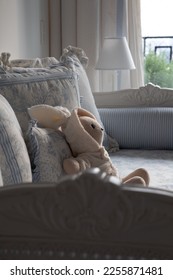 Teddy bear laying in sofa - Shutterstock ID 2255871481