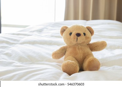 Teddy bear on comfort bed