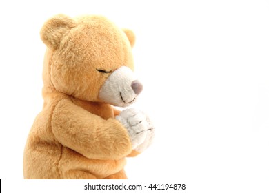 praying stuffed bear