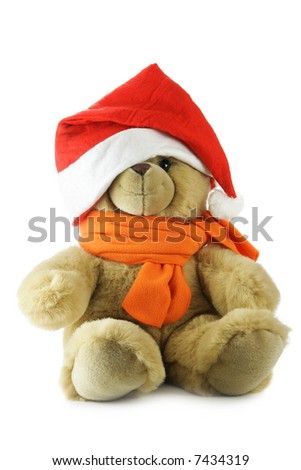 Teddy bear with Santa hat isolated over a white background