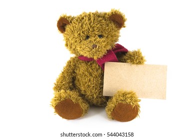 teddy bear sits and holds in paws a blank yellow sign