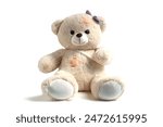 Teddy bear sits on a white background wounded.