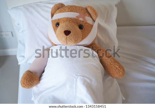 teddy bear with broken arm