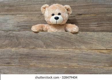 Teddy Bear Toy Alone With Old Plank