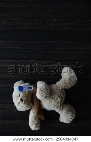 Teddy Bear with USB Flash Drive on Wooden Surface - Technology Integration in Childhood Toys