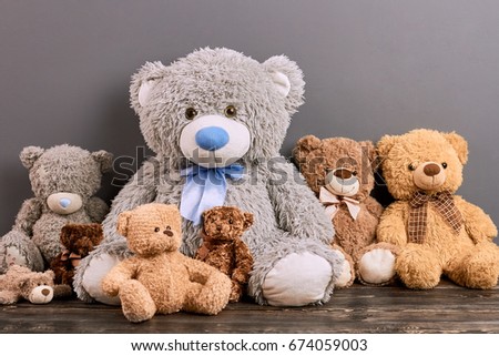 Teddy bears on wood surface. Cute soft toys. Toy buying guide.