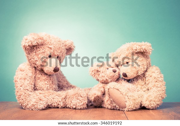 Teddy Bear's toy family concept. Retro old style filtered photo