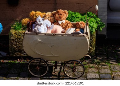 Teddy Bears And Toys In The Vintage Baby Carriage