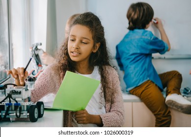 Teen African American Schoolgirl With Notebook On Stem Education Class