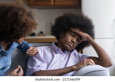 Teen African Girl Express Her Claim In Aggressive Manner To Boyfriend Sit Nearby Looks Annoyed, Ignoring Girlfriend, Feels Disinterested To Sort Out Their Relationships. Bad Relations, Quarrel Concept