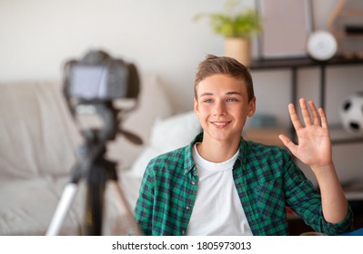 Teen Blogger Shooting Video For His Suscribers From Home, Waving At Camera