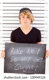 Teen Boy Holding A Blackboard Criminal Mug Shot