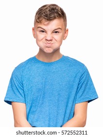 Teen Boy Making Funny Face. Half-length Emotional Portrait Of Child Wearing Blue T-shirt. Sad Kid, Isolated On White Background. 